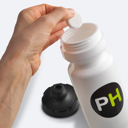 Precision Hydration PH 500 tablet being dropped into bottle
